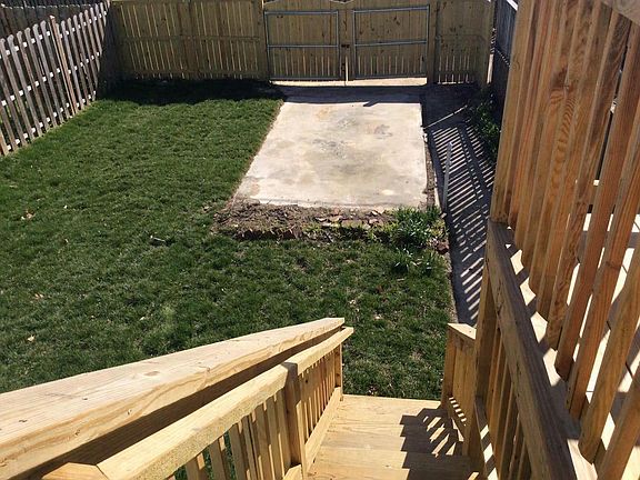 Fenced Backyard with Parking Pad