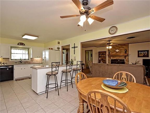 Updates in kitchen include counter tops, back splash, flooring, and paint.