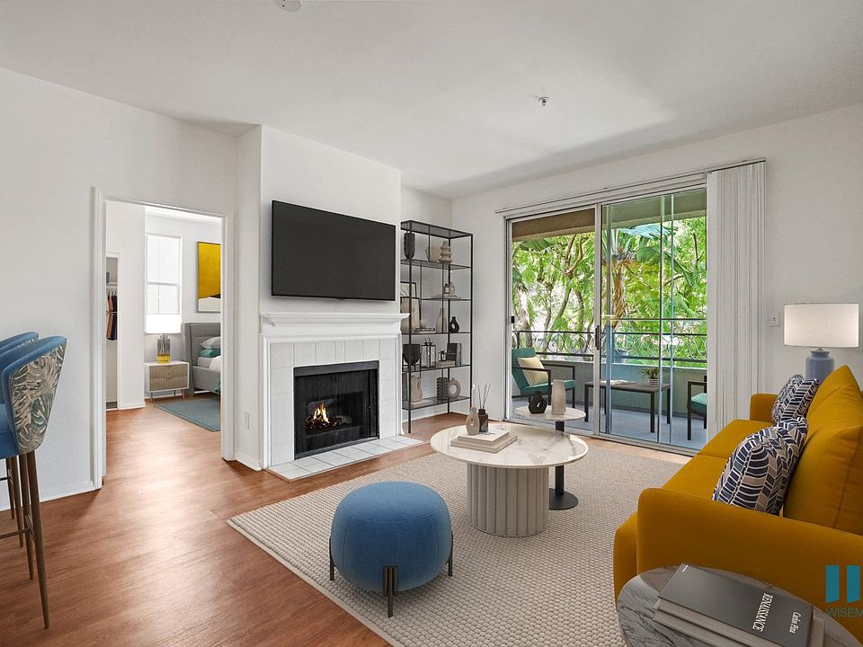 Living Room with Fireplace, Vinyl Flooring, and Patio