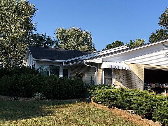 South view w/garage, sunroom