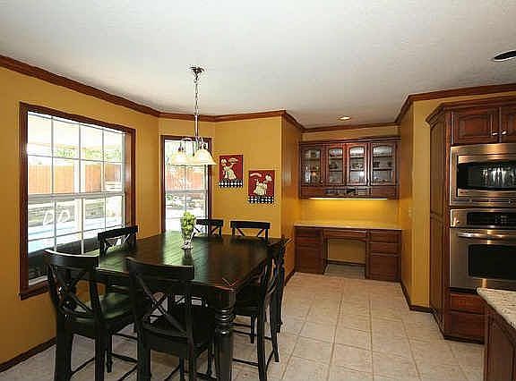 Large Breakfast Nook off kitchen with window looking over backyard