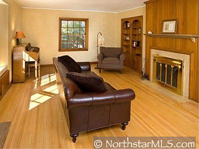 big formal living room w/ built-ins and working fireplace