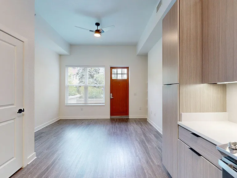 Apartment Living Room with Wood Style Flooring.