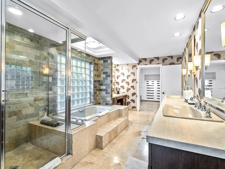 Spacious bathroom of first master with separate tub and shower.