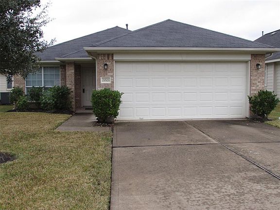 2 Car attached garage and double wide driveway. Nicely landscaped yard