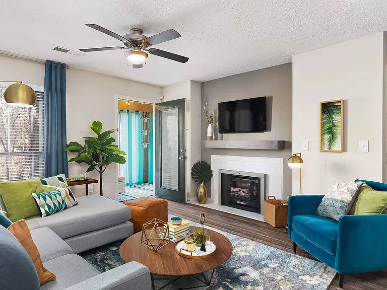 Bright Living Room featuring a Ceiling Fan and Modern Gas Fireplace - Diamond Interior