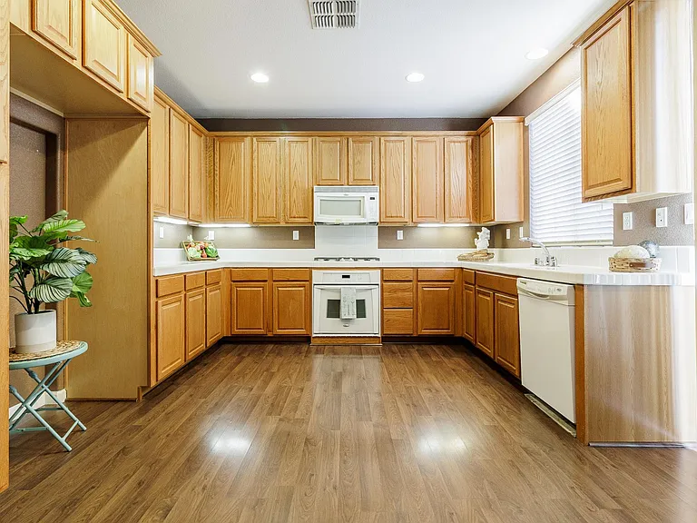 Kitchen has a gas cooktop and excellent lighting.