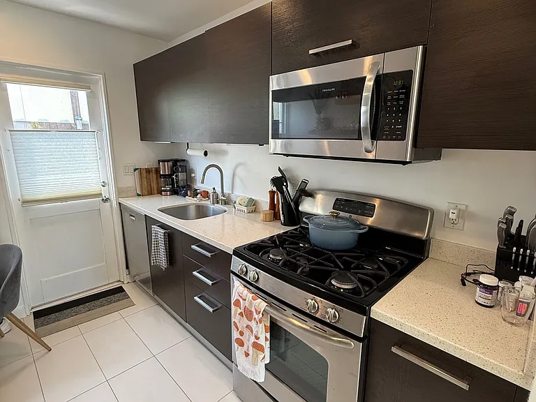 Stainless steel appliances with a built in microwave and stove and stainless sink