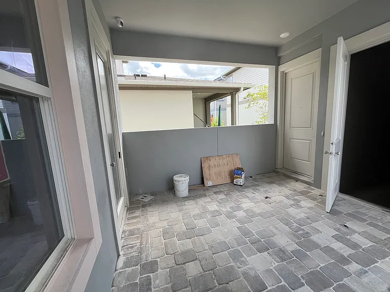 Entrance from shared courtyard, beside garage door!