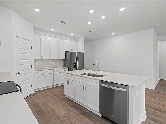 Kitchen in the Newport floorplan at a Meritage Homes community in Ocean Springs, MS.