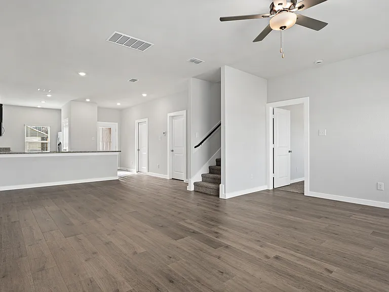 The Cottonwood has an open layout that connects the kitchen, dining room, and family room.