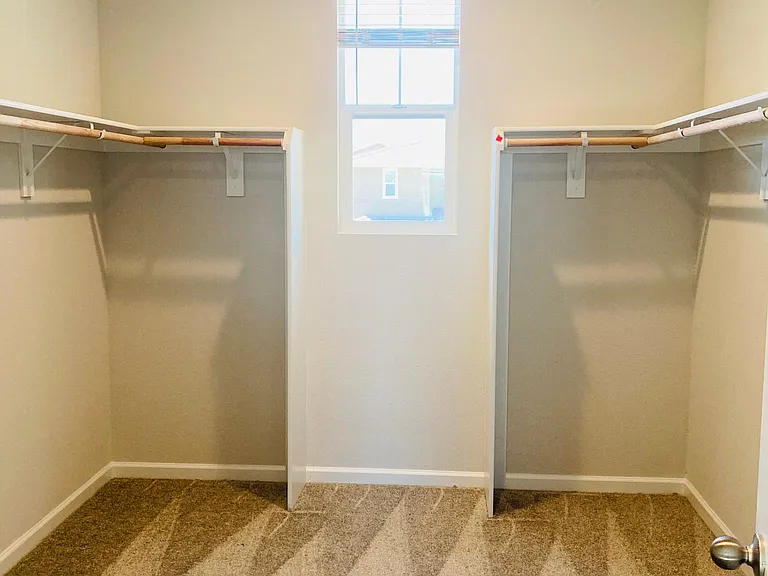 Master closet with a window