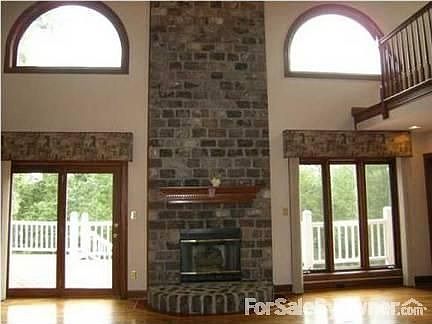 Great Room : Stone Fireplace and lots of windows