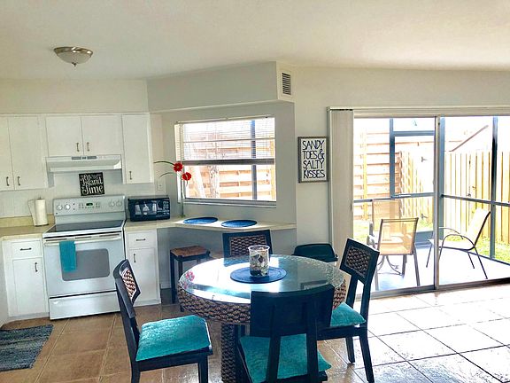 Unit 2 Kitchen/dining area with bright lighting.