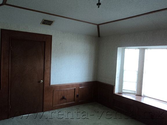 bedroom #3 with view to interior of Royal Village