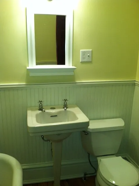 Remodelled bathroom with claw foot tub, 1940's American Stan