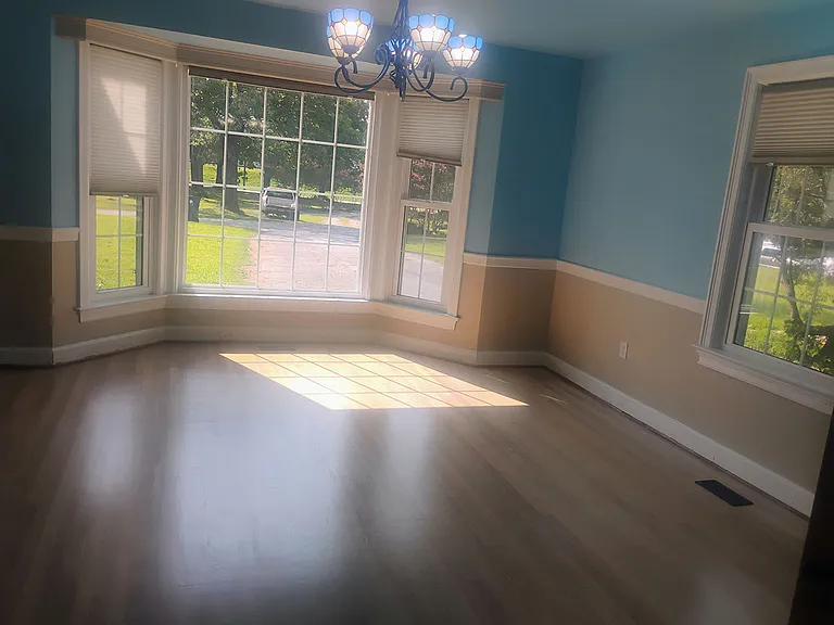 Newly refinished hardwood maple floors.