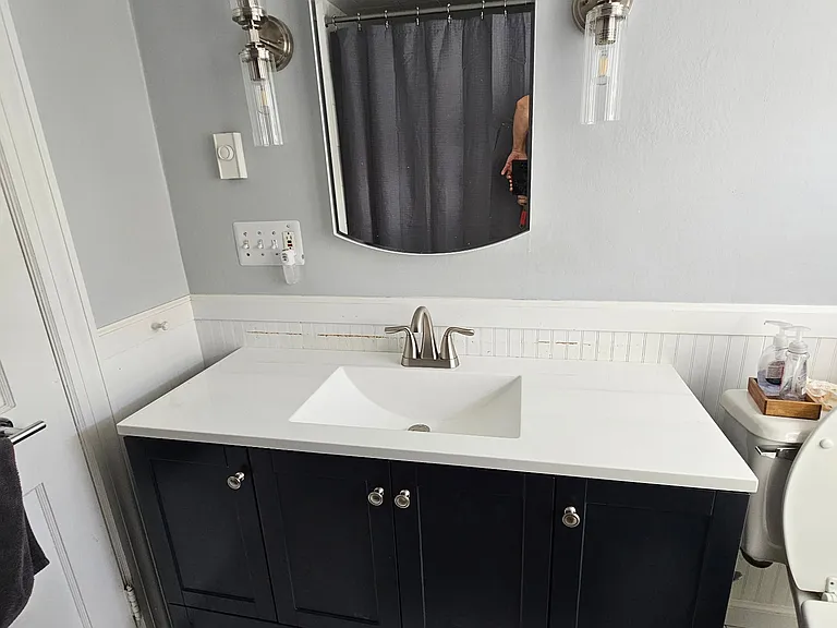 2nd floor bath with shower/tub combo white. 48" vanity new.