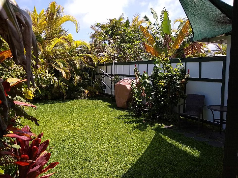Surfboard Racks to store your boards. BBQ, Seating area, Sunshade for backyard enjoyment