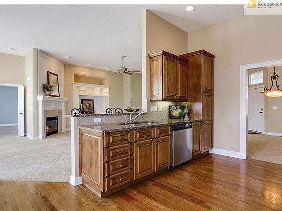 A convenient snack bar is between the great room and kitchen.  Enjoy the fire while keeping up with the kitchen conversation.