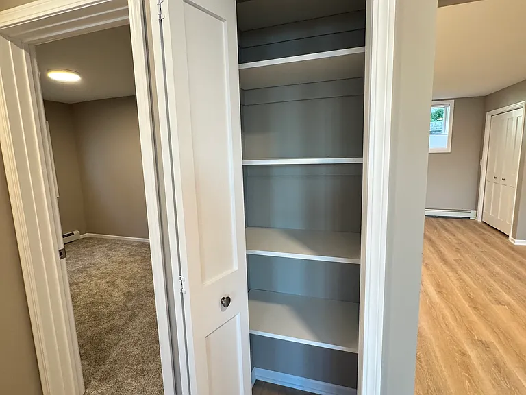 Linen closet just outside the bathroom and bedrooms
