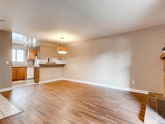 Dining area off of living room with breakfast bar.