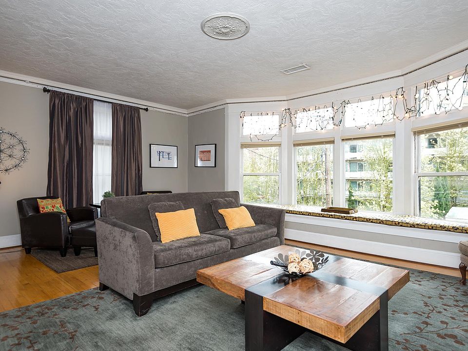 Living room with bay windows and lots of natural light