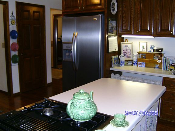 Gas Jenn-air range and stainless steel refrigerator