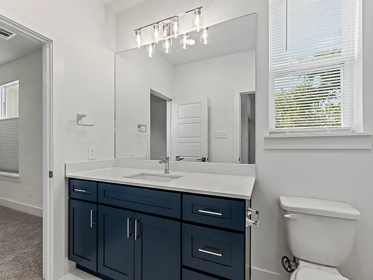 The upstairs bathroom has a combo tub/shower and access from bedrooms 2 and 3. Bathroom is 9' x 5'