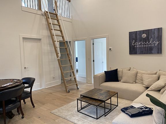 Family room with TV. This level has three bedrooms, two bath and a loft.