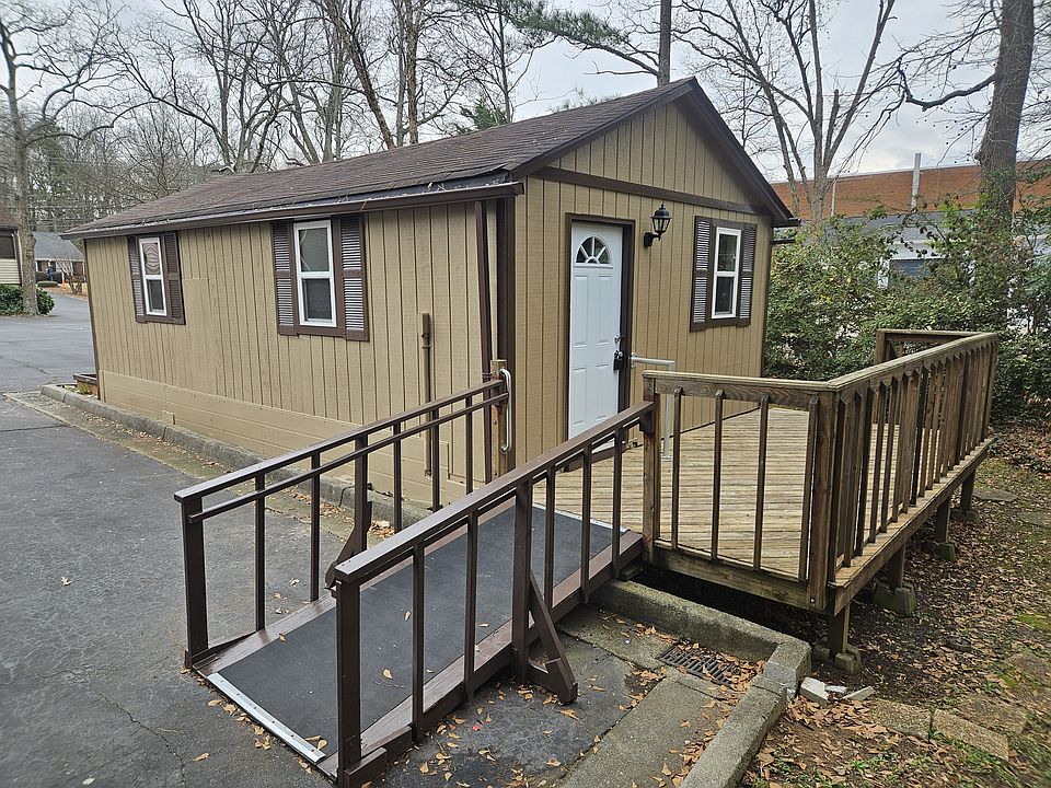 Front Door with deck overlooking woods