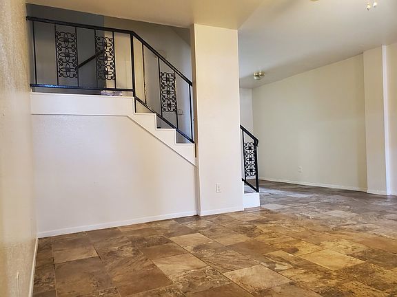 room for a dinner table across from stairs