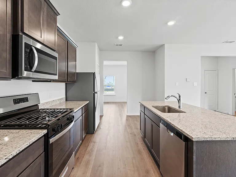 The kitchen of the Camelia has a a full suite of energy-efficient appliances.