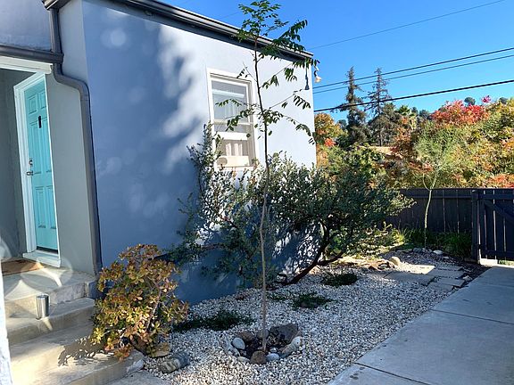 Sun splashed and surrounded by gardens, a cozy abode beckons...your own private entry with no hallways, elevators, or enclosed stairways to get to your home.