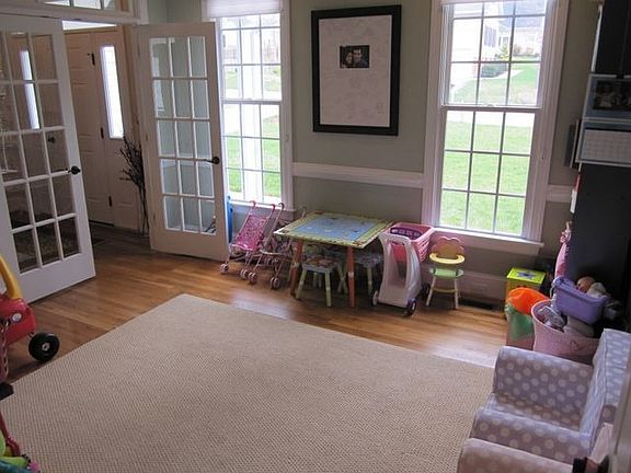 Living Room: French doors with transom to Foyer.  Additional door to family rm