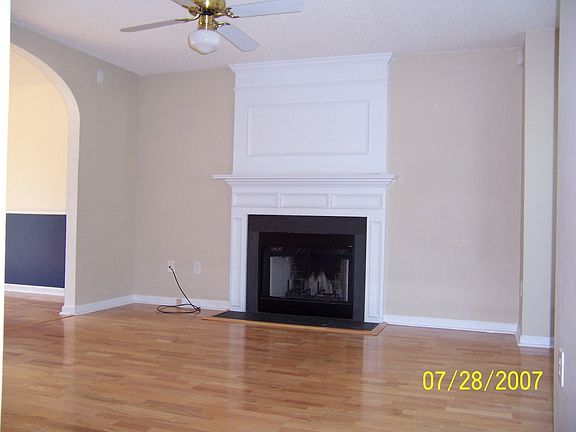 Living room with wood burning fireplace