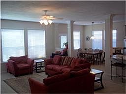 The large open family room gets lots of light from the windows looking over the backyard.