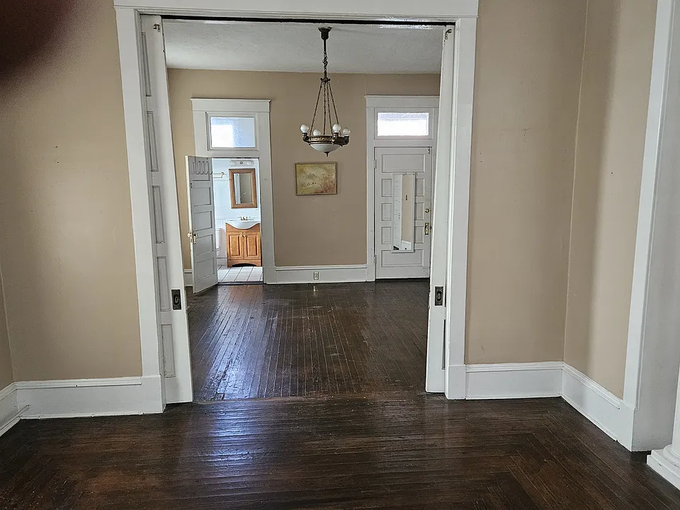 Living room, sliding doors, bedroom, bath