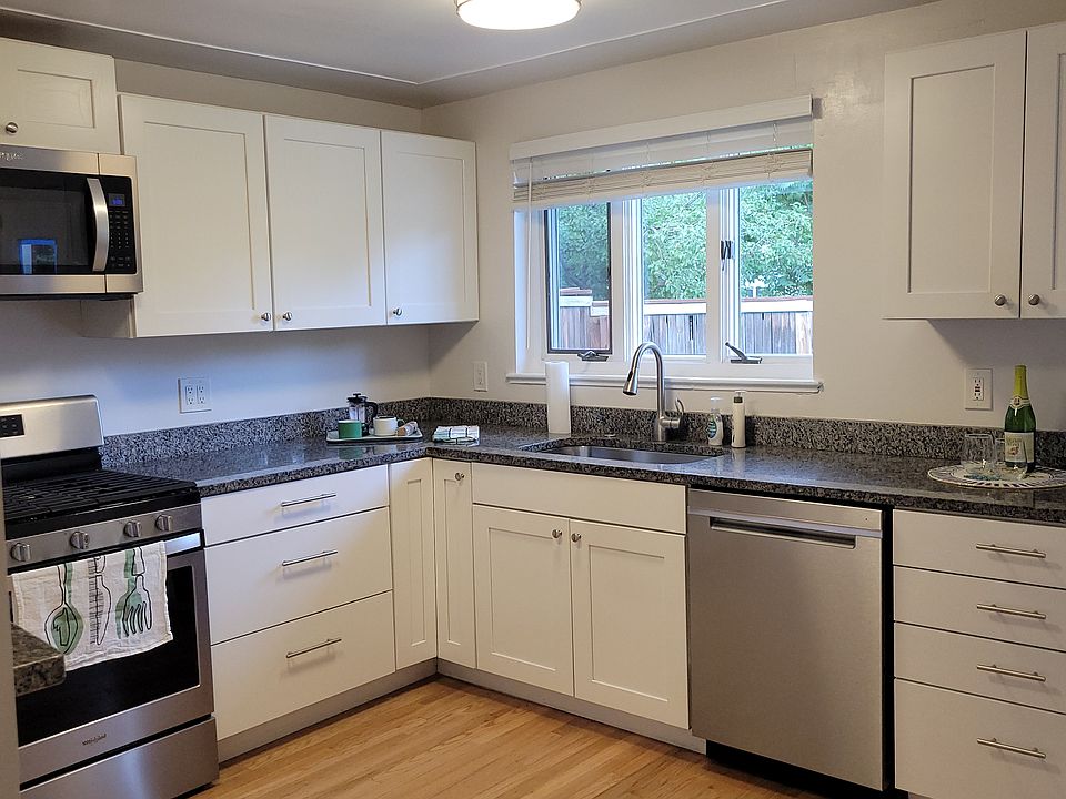 Beautifully Updated Kitchen. View to backyard.