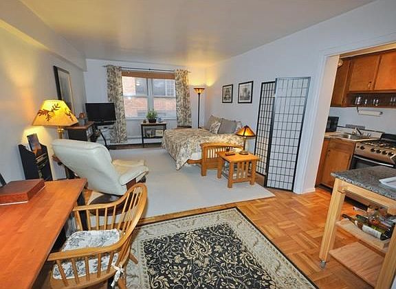 The spacious living room has parquet floors.