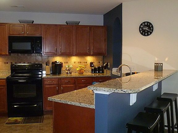 Kitchen w/barstool eating