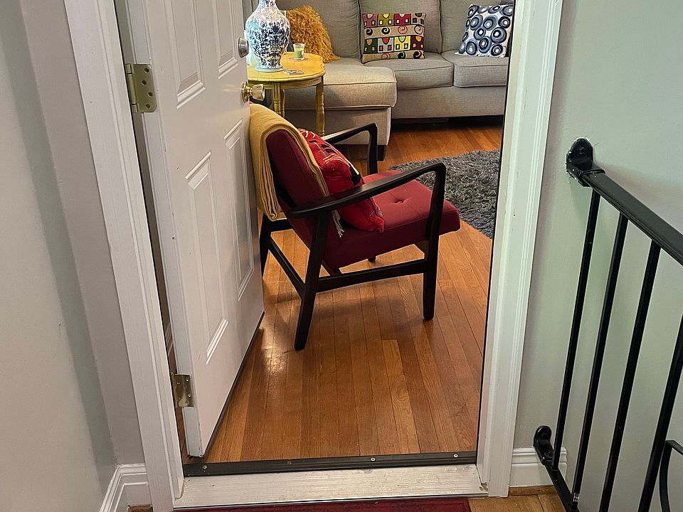 This door opens from the interior front hall into the living room.