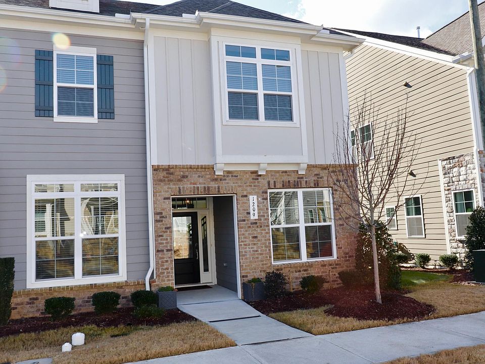 Townhouse facade includes the front facing windows. Feels much bigger on the inside!