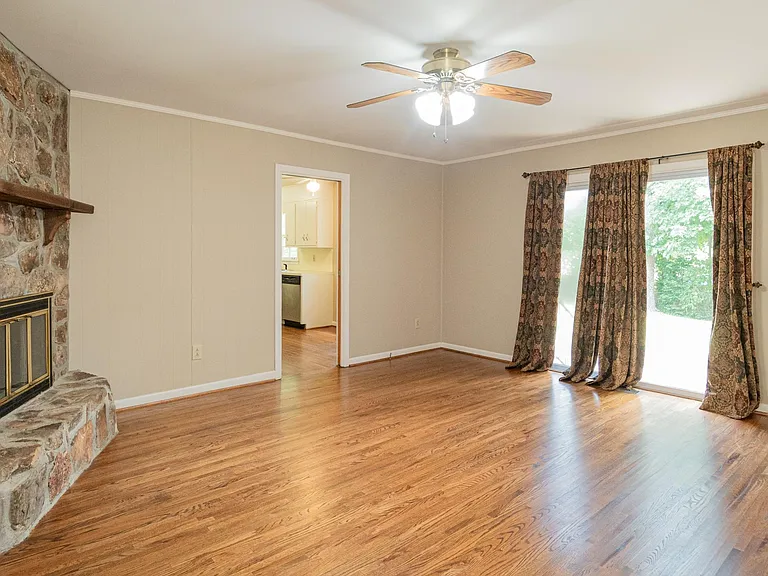 DEN WITH SLIDING GLASS DOORS LEADING TO PATIO