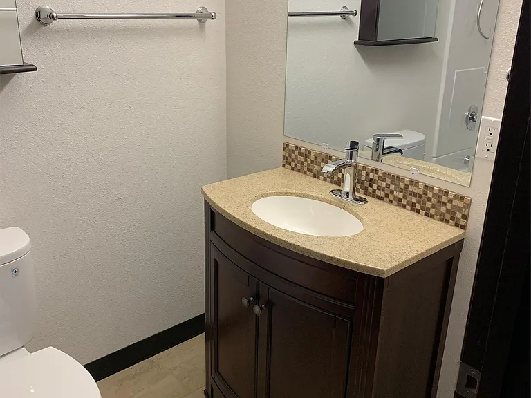 Bathroom has been completely re-plumbed &renovated with new tub, toilet, vanity, and tile floor.