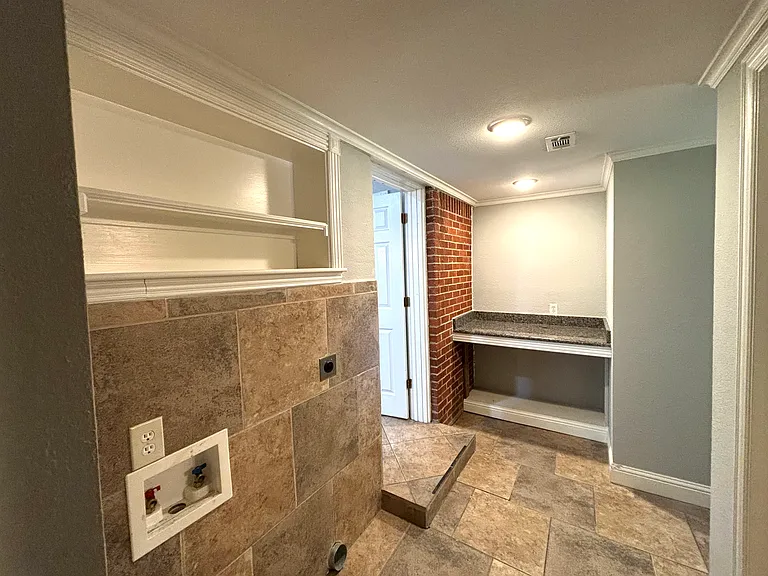 Laundry room with folding bar