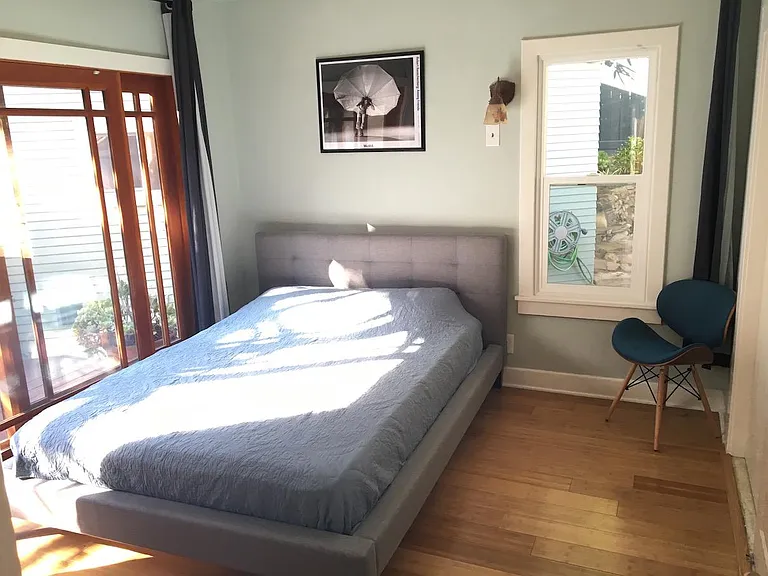 One of two bedrooms that open up to wooden deck