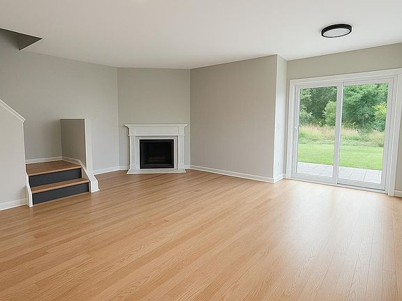 Living area with gas fireplace with outlets for a wall mounted TV
