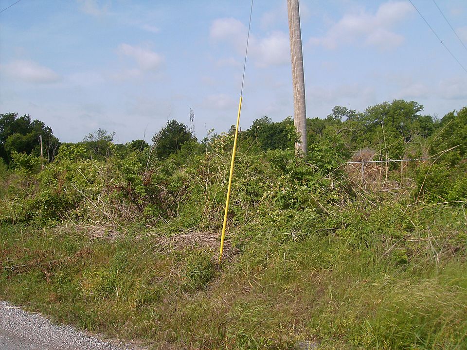 So. boundry, at telephone poles.