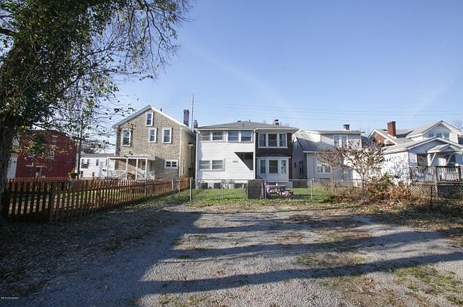 View of backyard and off street parking